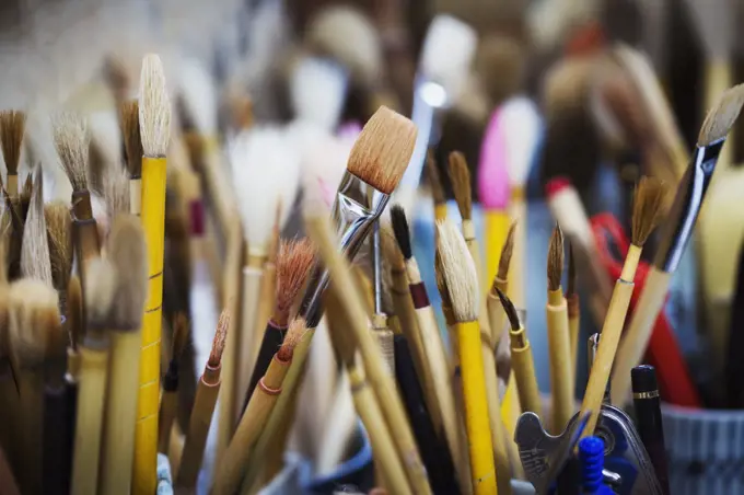 Close up of a selection of paintbrushes in a Japanese porcelain workshop.