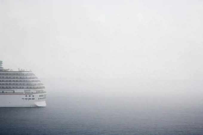 Cruise ship in fog on ocean