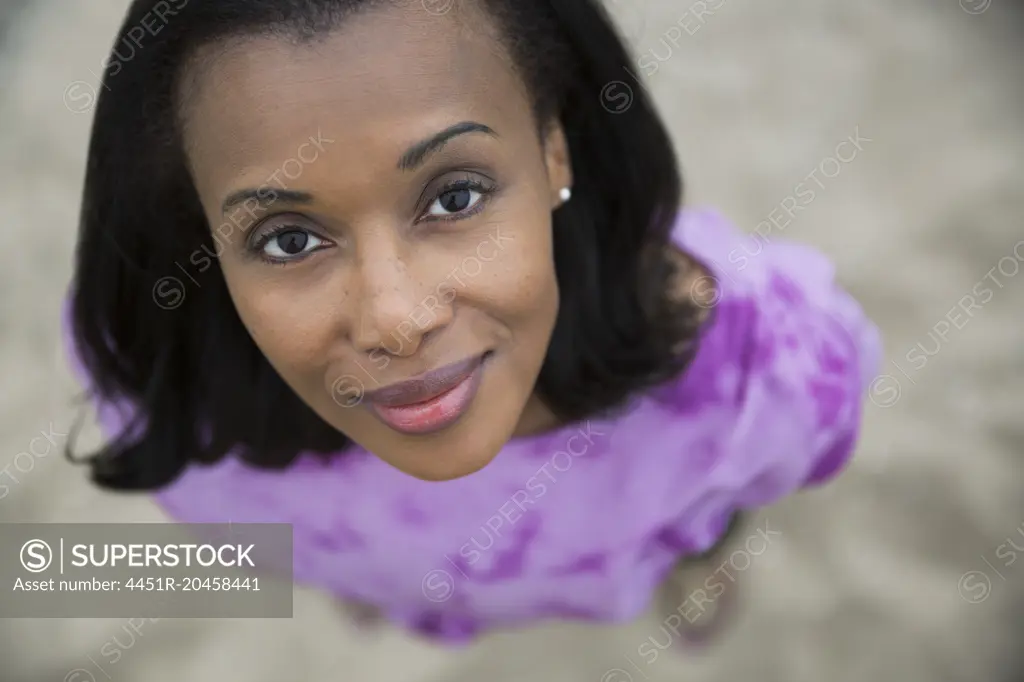 Overhead portrait smiling woman with black hair