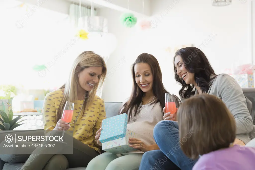Female friends celebrating baby shower