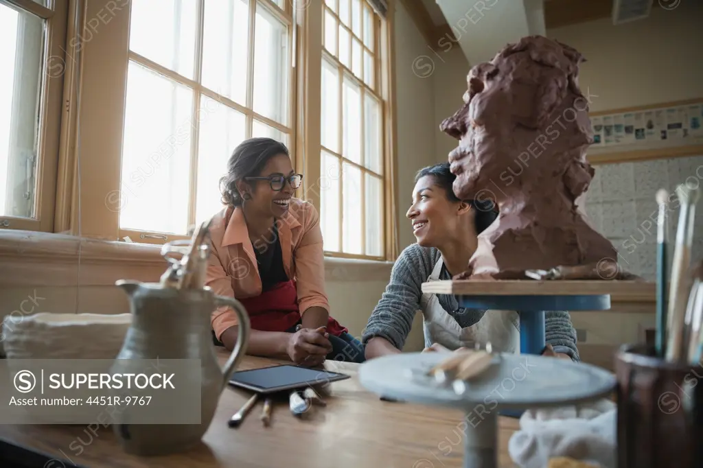 Female students in pottery studio