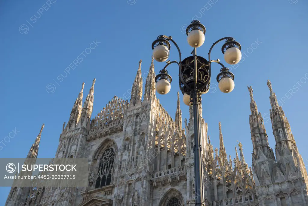 Milan Cathedral and Street Lamp with Sunlight in Lombardy, Italy.