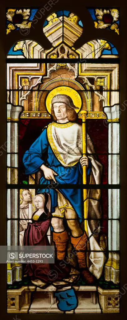 Saint Roch with the van Merle Family; coat of arms and a donor; pot-metal glass.