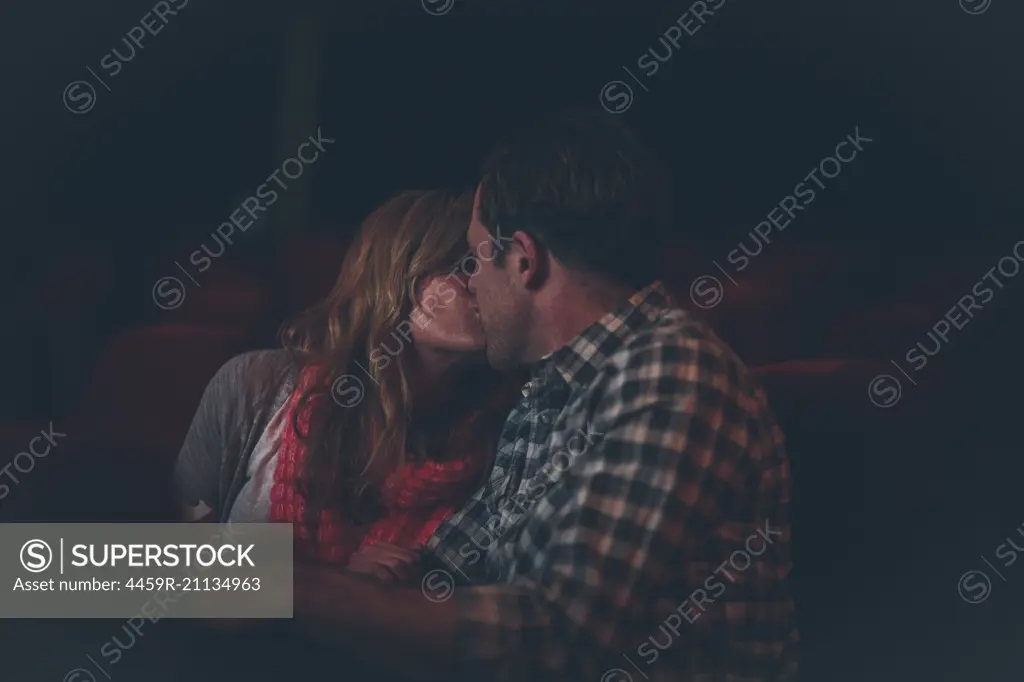 Couple Kissing in Movie Theater