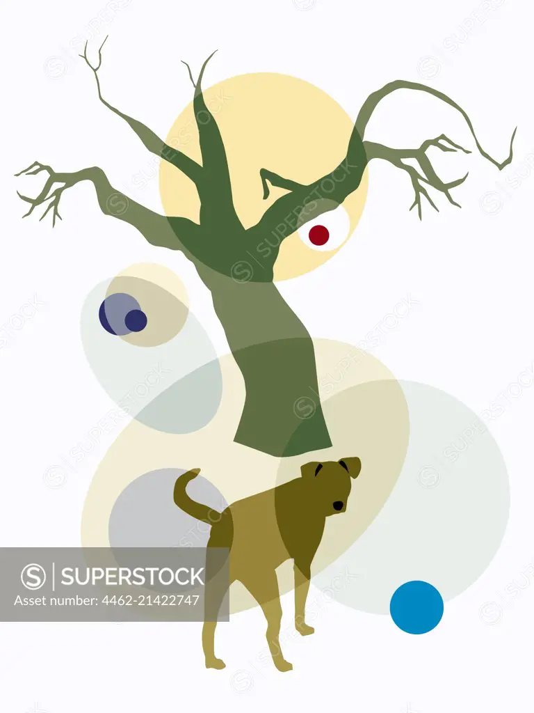 Dog by bare tree