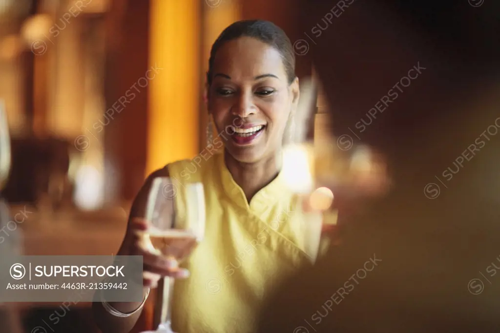 Couple having a glass of wine at an upscale restaurant.