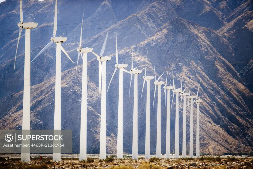 Group of wind turbines in a field.