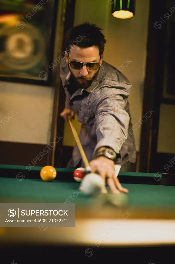 A man playing pool.