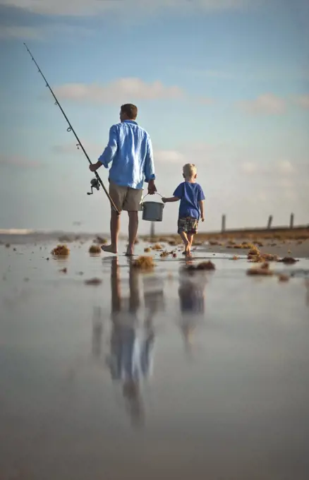Father and son fishing a day of fishing at the beach.