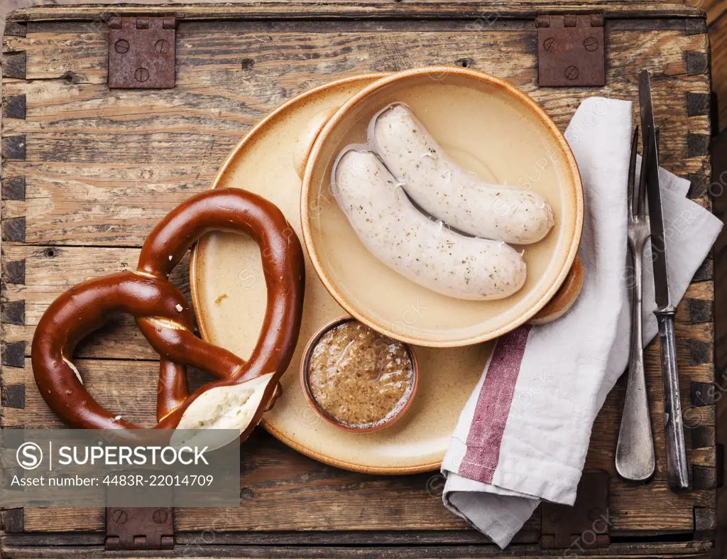 Bavarian snack with weisswurst white sausages and pretzel