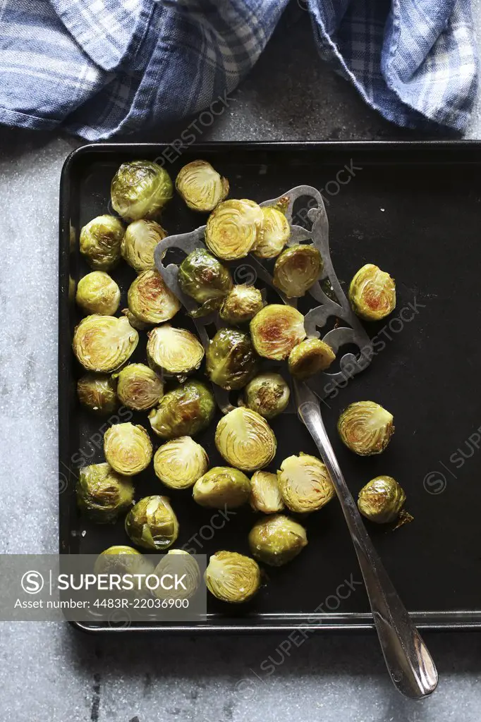 Roasted brussels sprouts on a pan.Top view