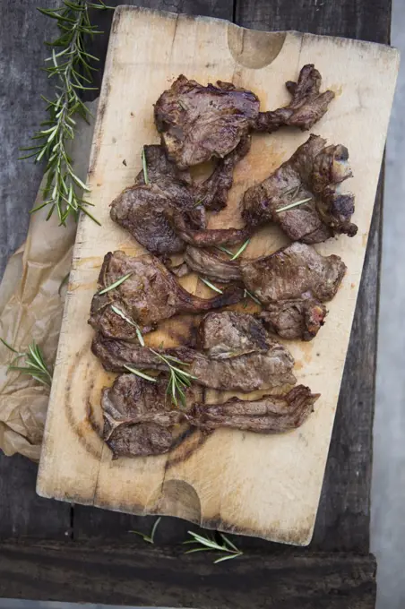 Lamb Chops with Rosemary on a board