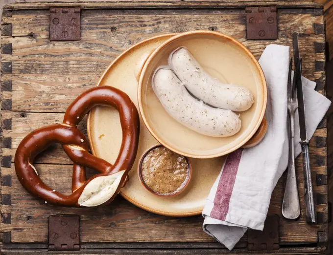 Bavarian snack with weisswurst white sausages and pretzel