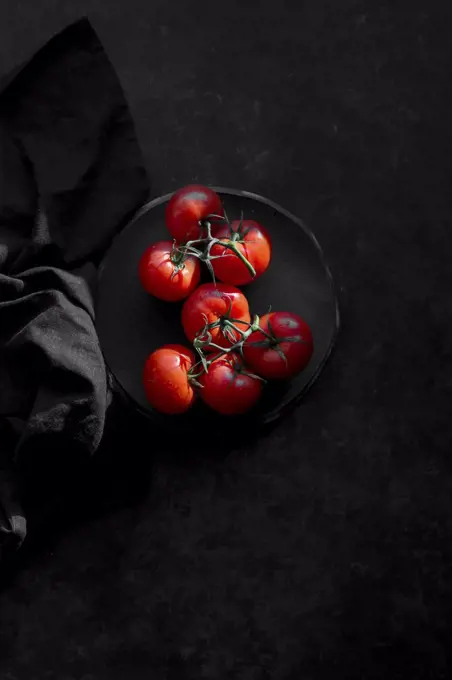 Tomatoes on a black background