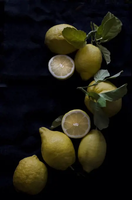 Fresh lemons on a black background
