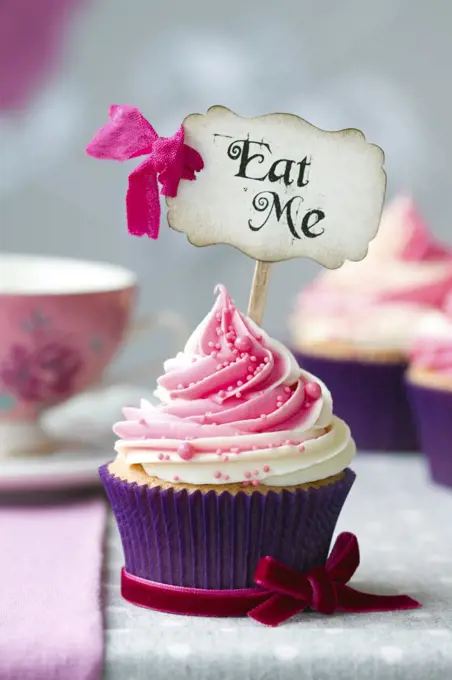 Cupcake with "Eat Me" pick