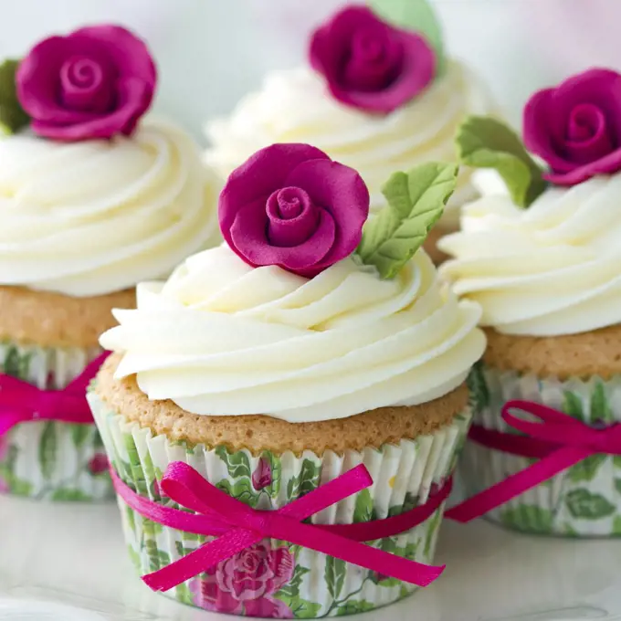 Cupcakes decorated with pink sugar roses