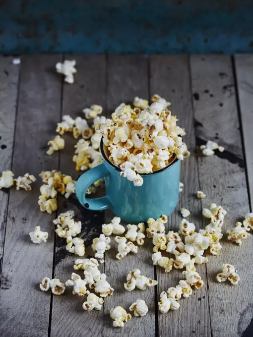 Blue cup full of popcorn