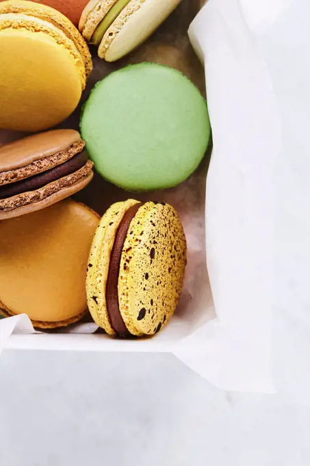 White box with seven macarons of various taste