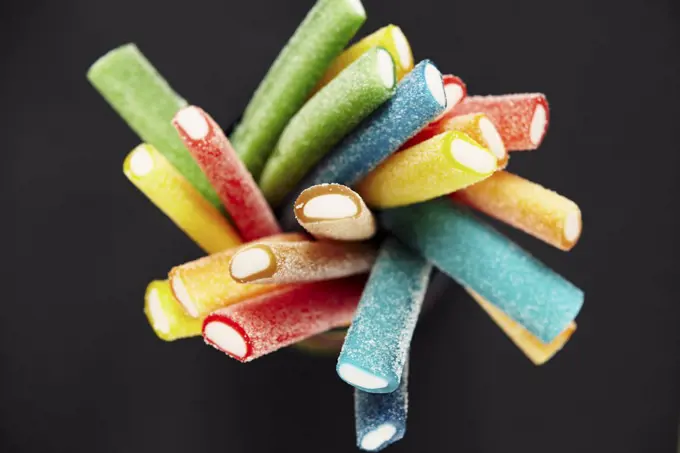Stack of coloured gummy sweet sticks