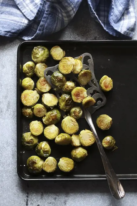 Roasted brussels sprouts on a pan.Top view