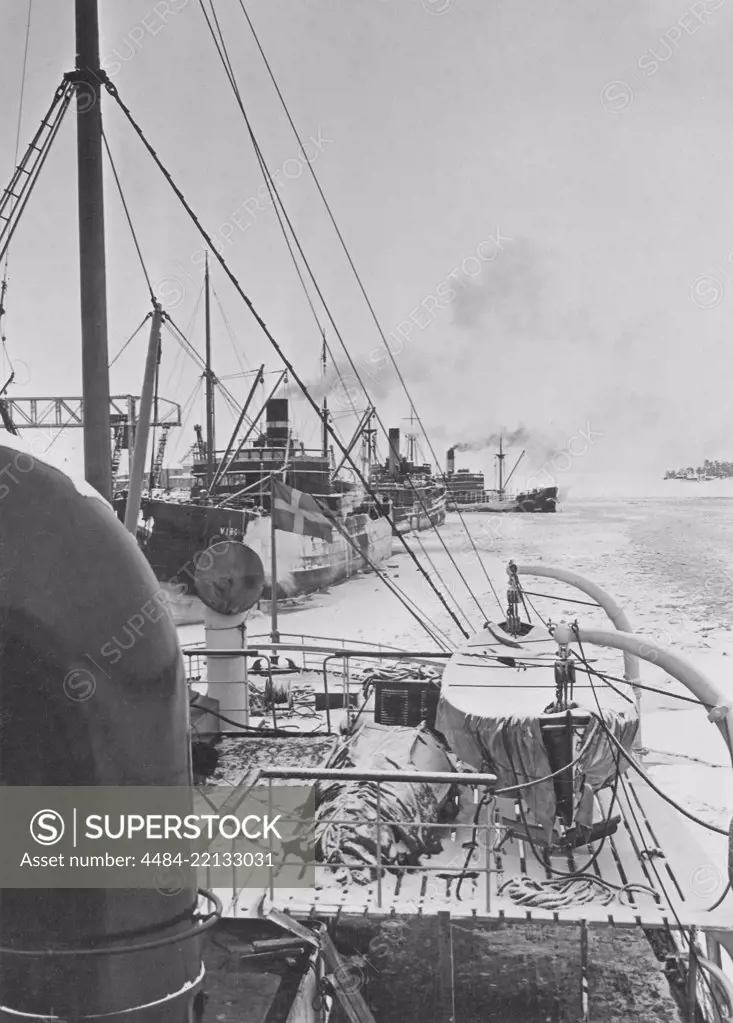 Winter at sea in the 1940s. Pictured the swedish icebreaker Atle in the Baltic sea with a convoy of ships following it in the channel of water created through the ice by the icebreaker. The winter of 1942 was one of the coldest in Scandinavia. Sweden 1942 