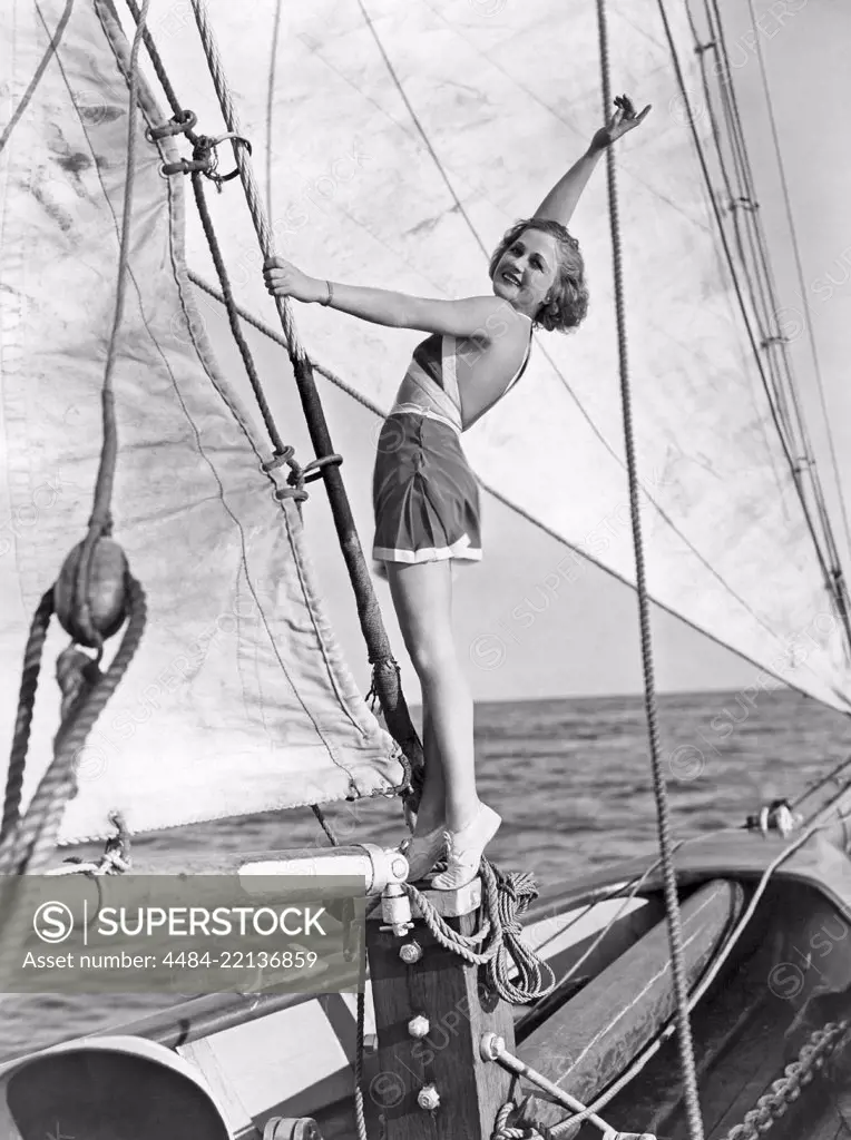 American actress in the 1930s. American actress Wynne Gibson, 1898-1987. She was contracted with movie company Paramount and made some 50 films between 1929 and 1956. Pictured here wearing a 1930s summer outfit aboard the sailing schooner Mariner. 1930s