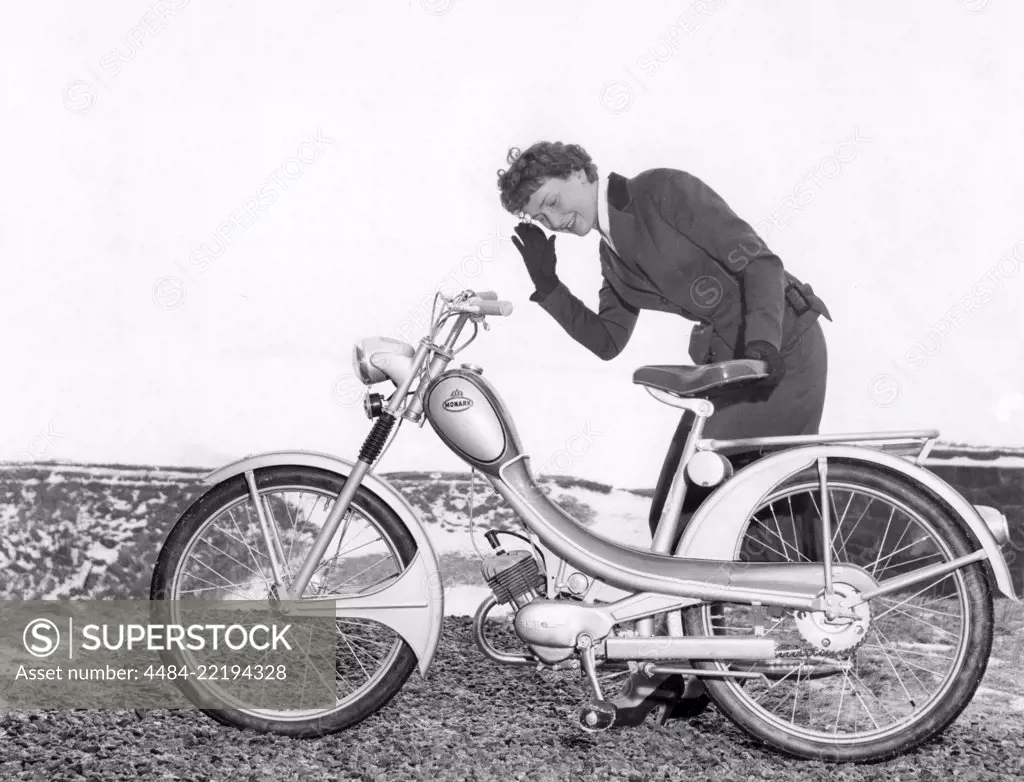 Woman of the 1950s. A young woman with a new Monark moped 1956.