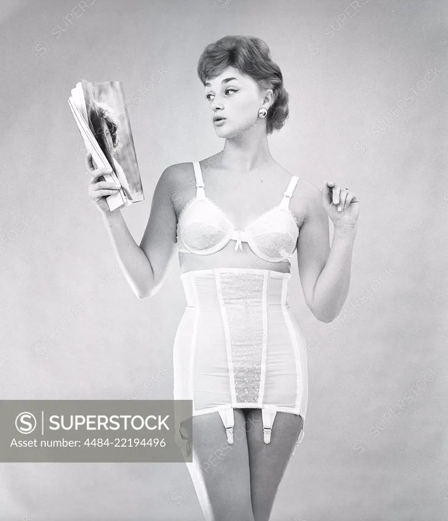 1940s Woman Vintage Girdle Stockings Wearing Stock Photo