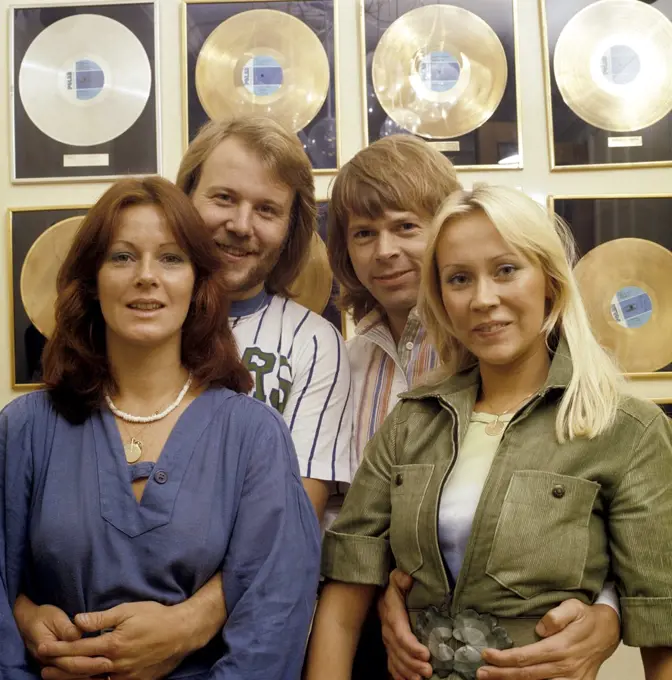 ABBA. Anni-Frid Lyngstad, Benny Andersson, Agnetha Fältskog and Björn Ulvaeus in the 1970s in front of a wall full of gold records for record selling albums.