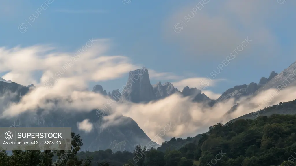 Majestic mountain range against cloudy sky during the day in nature