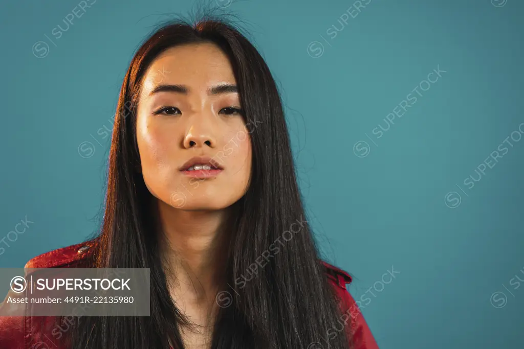 Portrait of young stylish Asian woman
