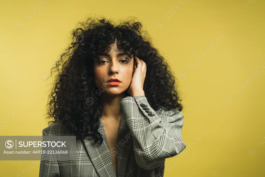 Curly woman in studio