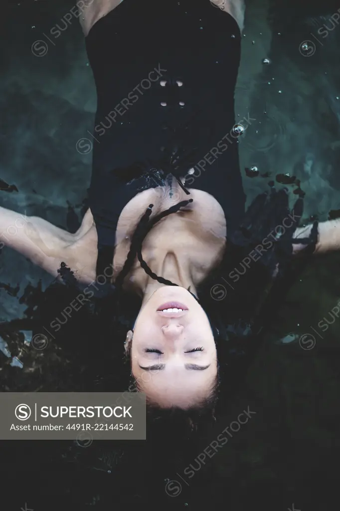 Woman relaxing and swimming