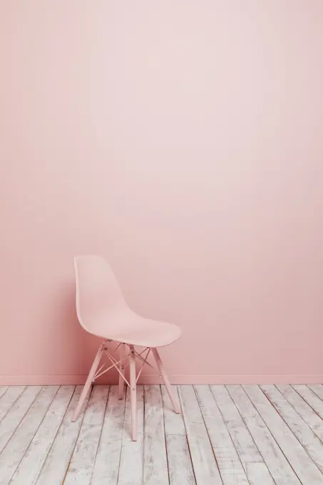 Side view of a single design pink chair on a pink background