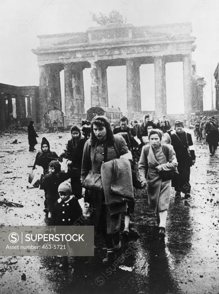 Group of refugees walking on the road, Brandenburg Gate, Berlin, Germany, 1945
