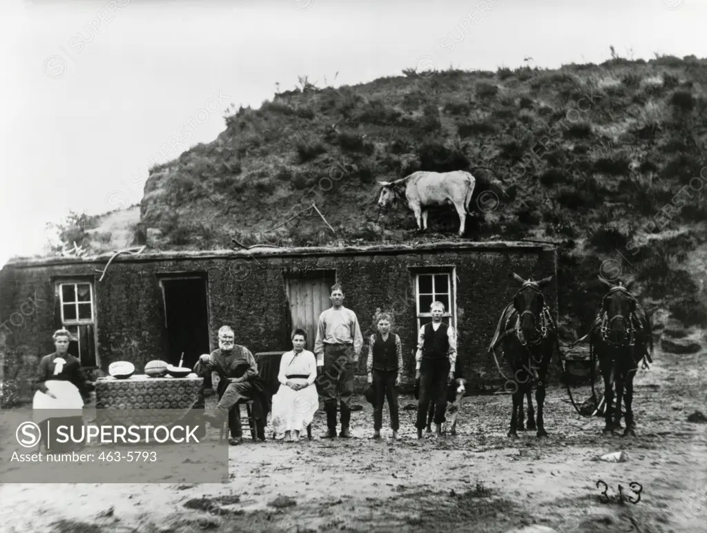 Sylvester Rawding and family in front of their sod house, Custer County, Nebraska, USA, Photo by Solomon D. Butcher