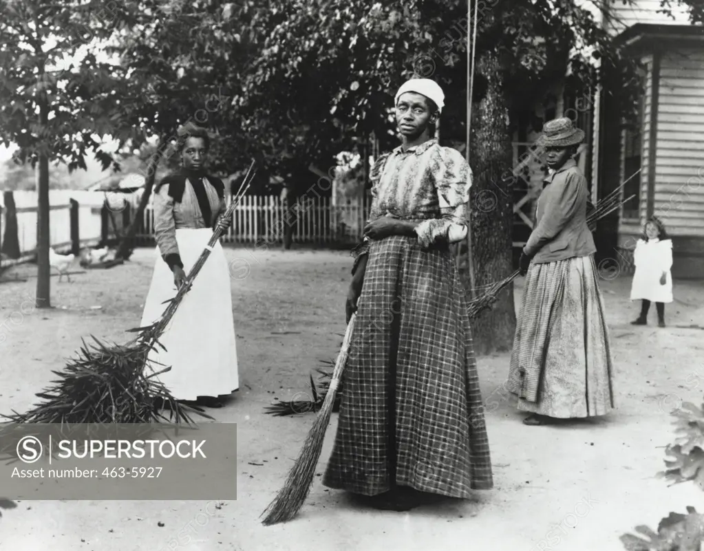 Three mid adult woman holding brooms, Belton, South Carolina, USA, 1899