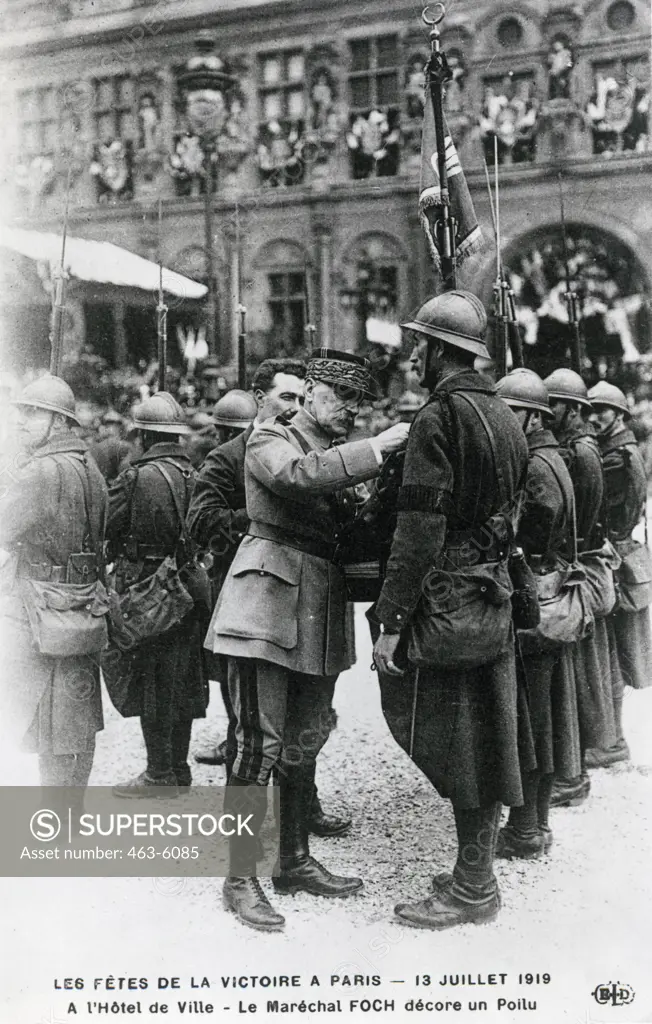 Marshal Foch confers decorations upon soldiers in front of the Hotel de Ville, Paris, France July 13, 1919