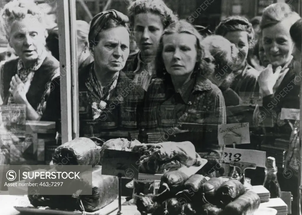 Female shoppers gather outside a grocery store, Germany, June 1948