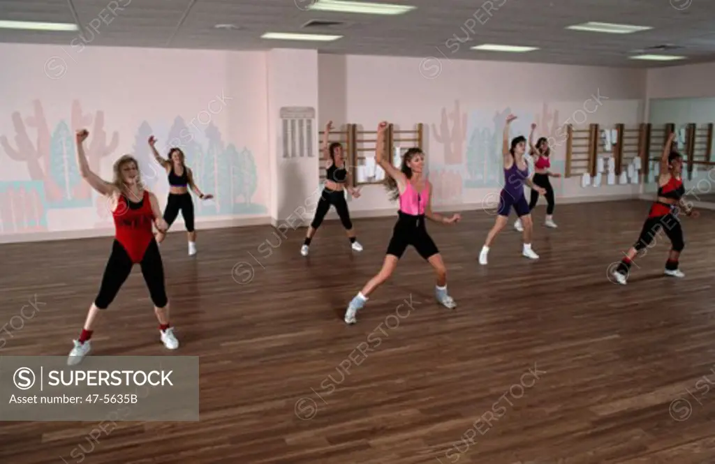 Group of young women exercising in a health club