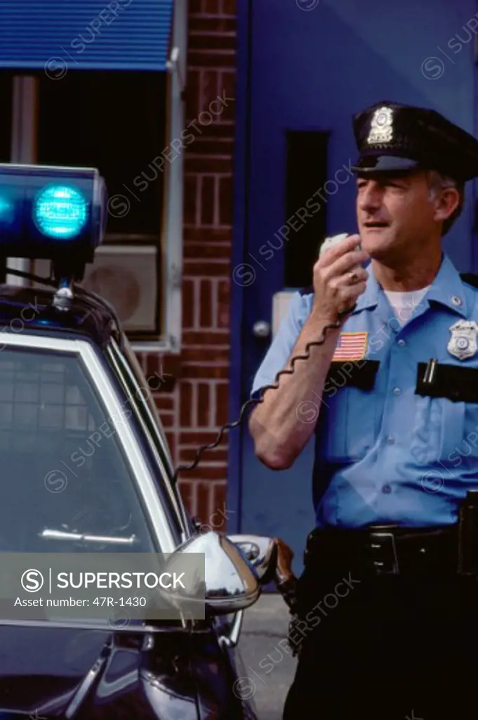 Policeman talking into a CB Radio