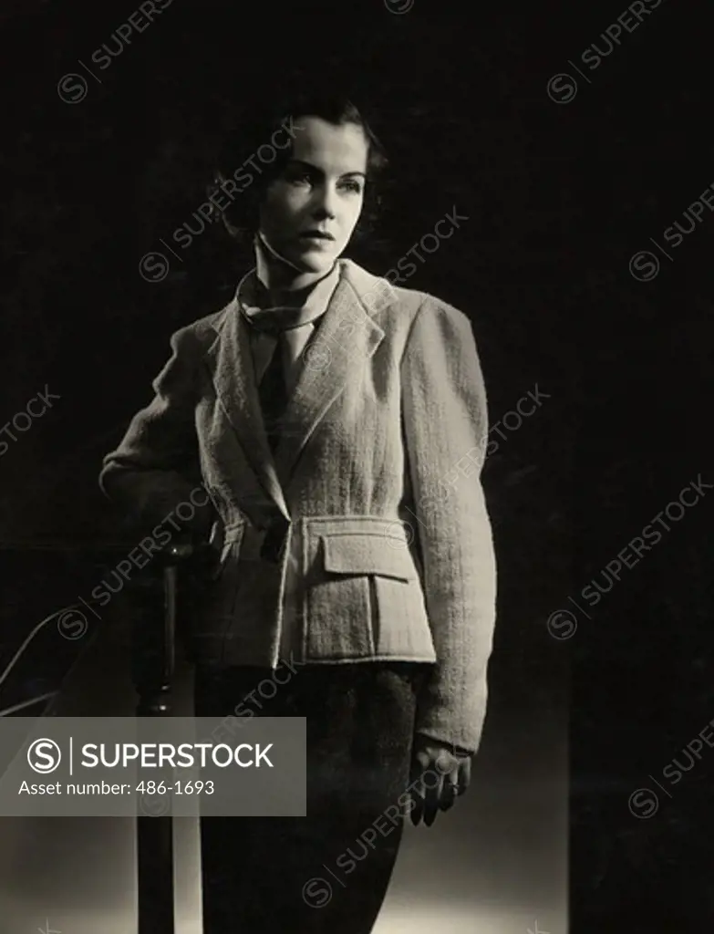 Studio shot of young woman in suit