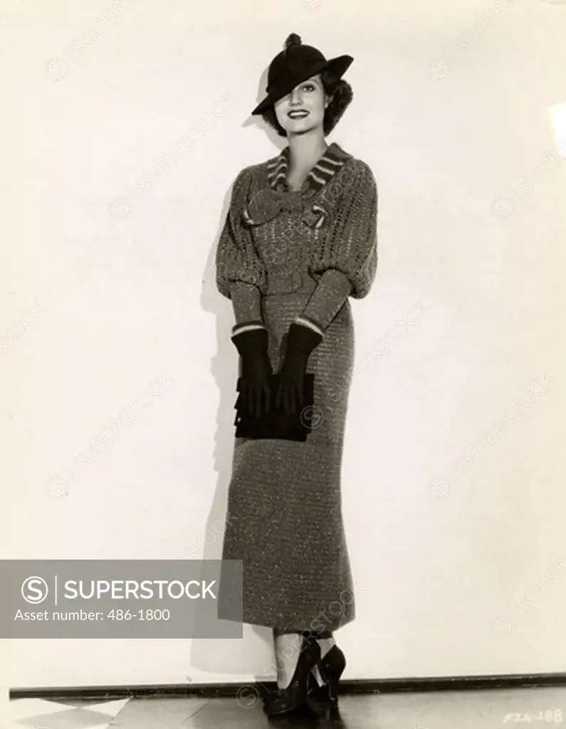 Fashion model posing in woolly dress