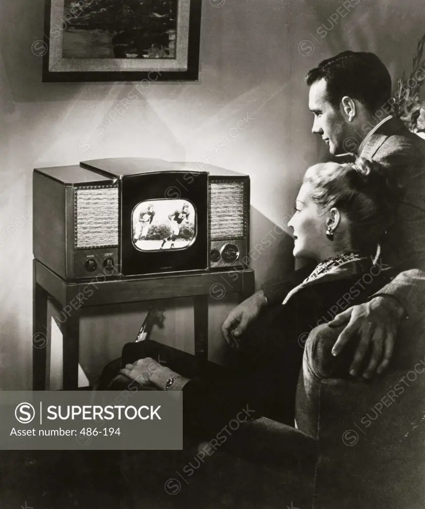 Young couple watching television in a living room, 1947