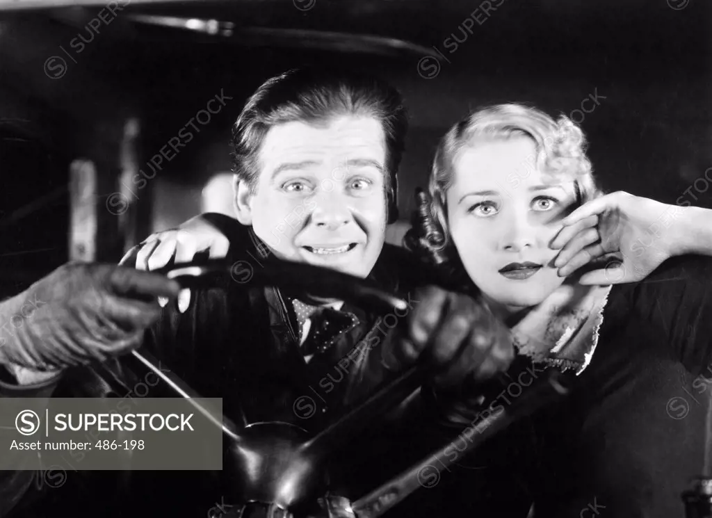 Close-up of a young couple in a car
