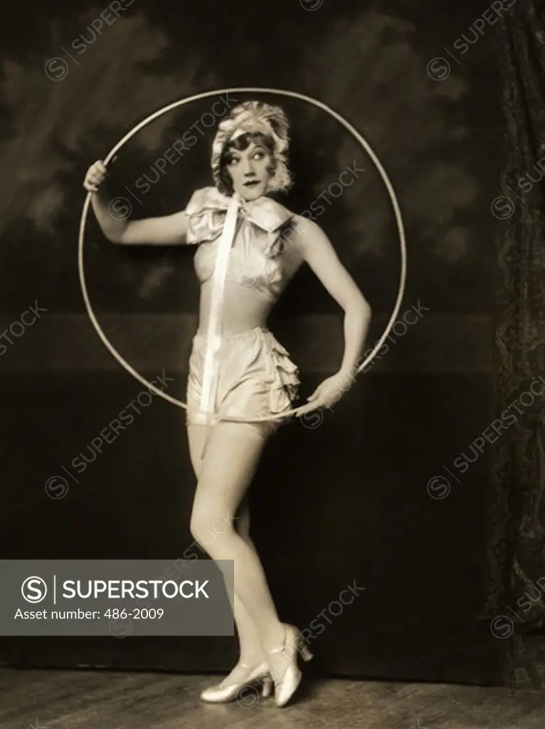Portrait of woman with plastic hoop