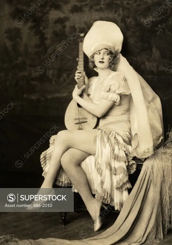 Portrait of woman holding mandolin