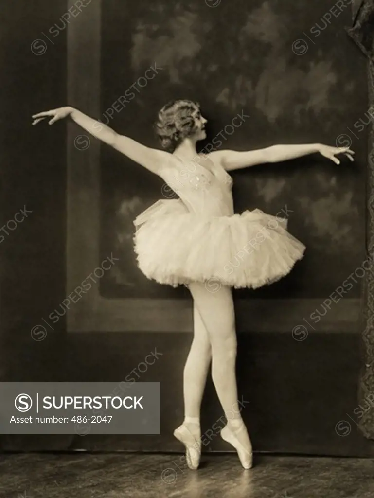 Young woman performing ballet pose