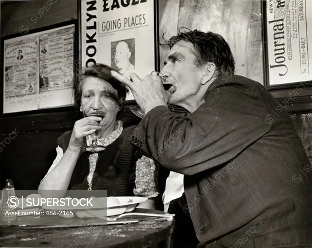 USA, New York City, Broadway, Man And Woman Drinking In Cafe